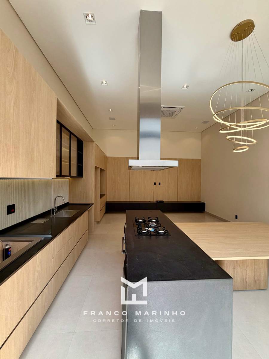 Ilha com cooktop e mesa