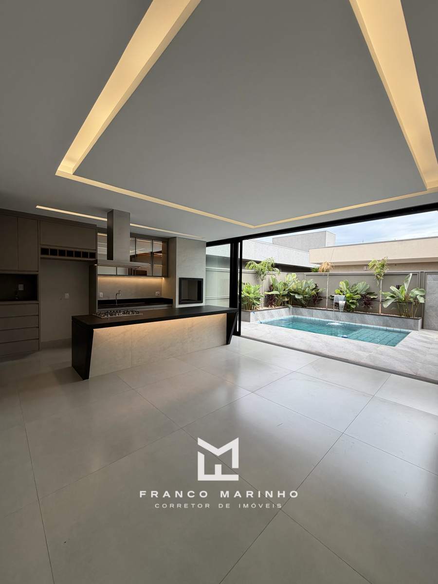 Cozinha gourmet com ilha integrada à piscina