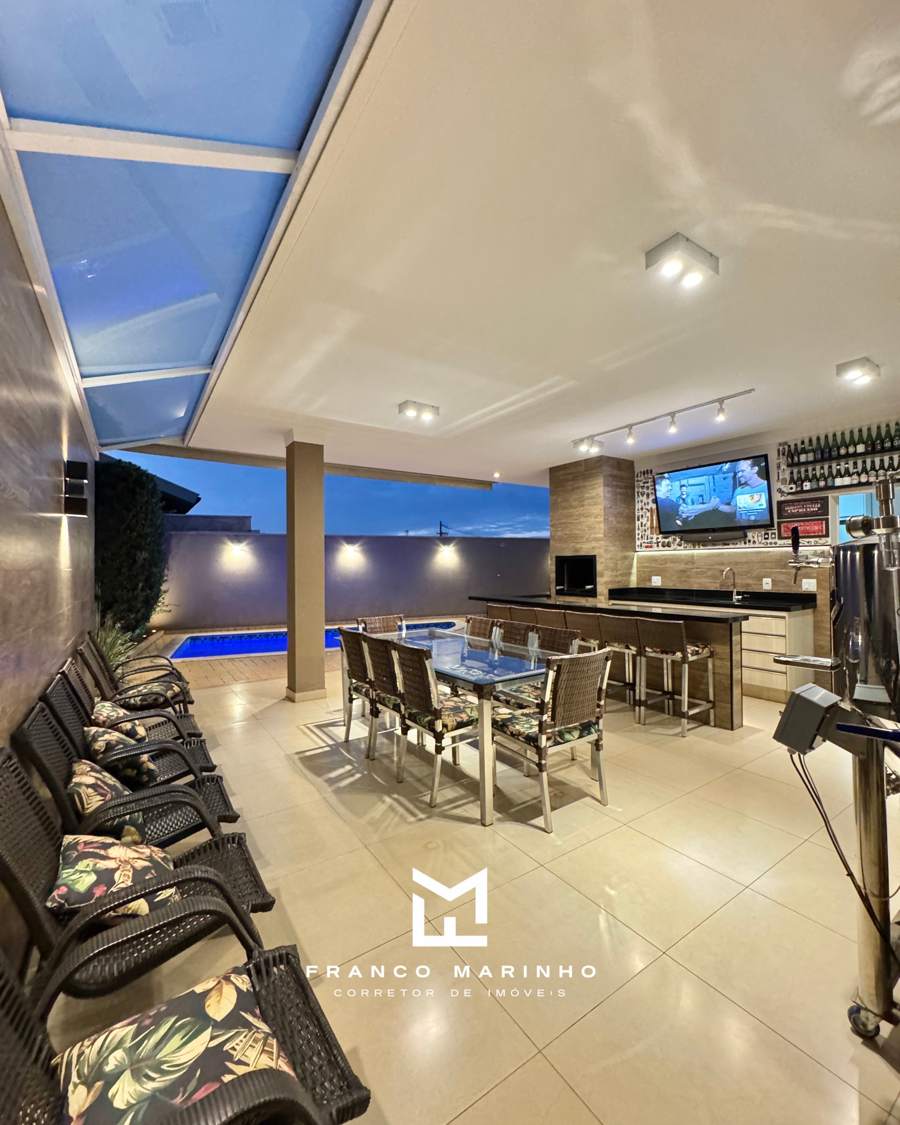 Varanda gourmet ampla com mesa para 8 pessoas