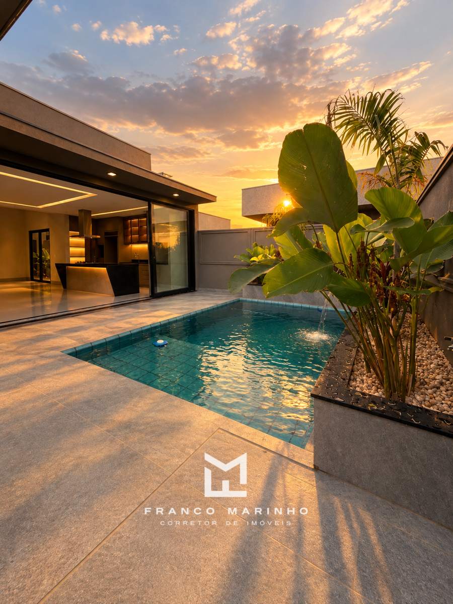 Piscina com cascata ao pôr do sol