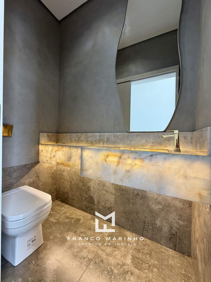 Lavabo com bancada iluminada em pedra