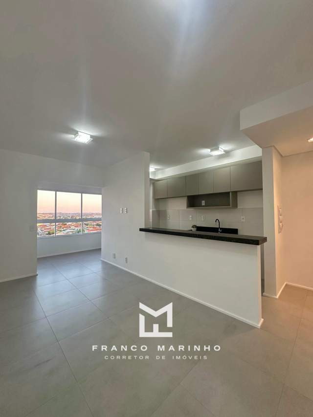 Sala e cozinha americana do apartamento no Persona Residence Club